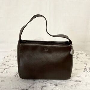 The Sak pure leather small brown hand bag with silver toned accents